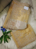 Gold Tissue Saree Featuring Intricate Hand Embellishment