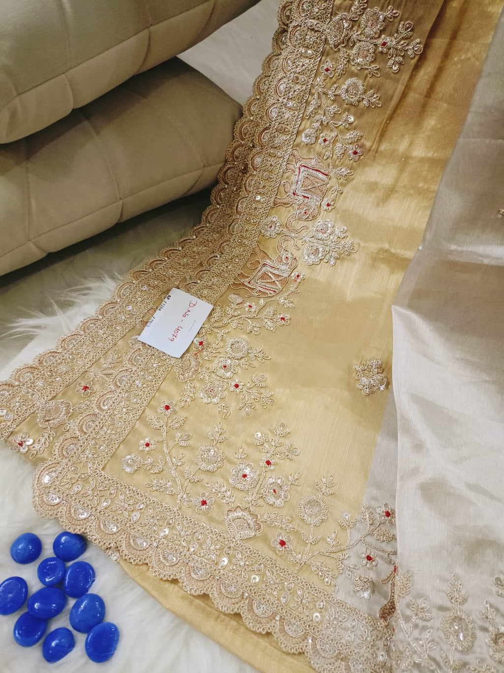 Gold Tissue Saree Featuring Intricate Hand Embellishment